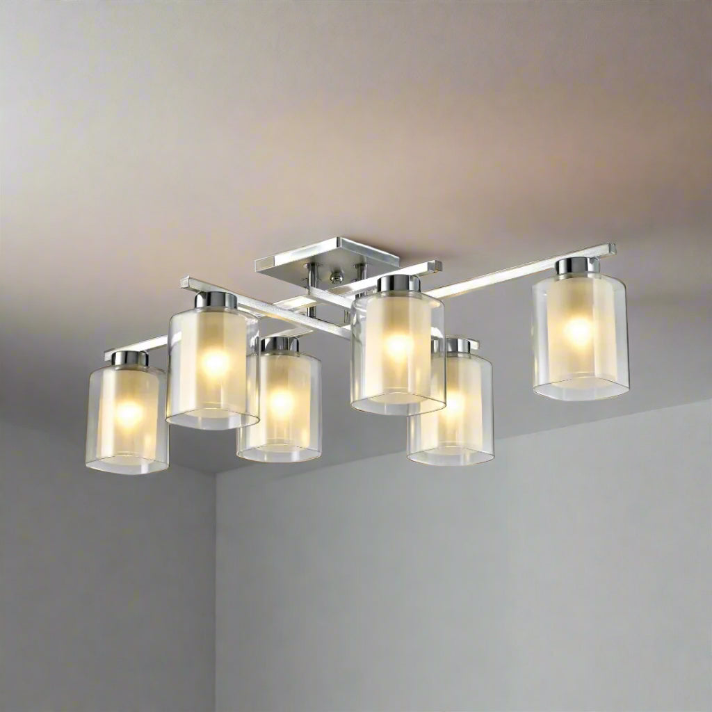 Multi-light rectangular chandelier with ten cylindrical frosted glass shades in two rows, mounted on a chrome base.