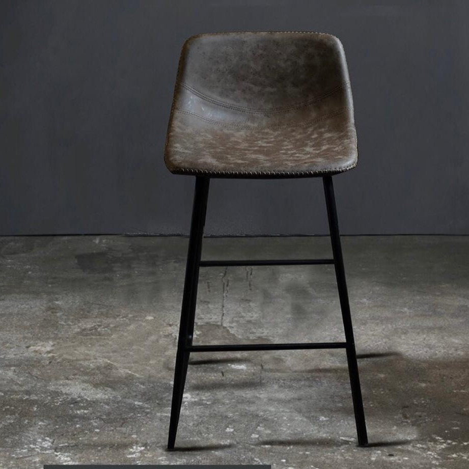 An industrial style bar stool with a leather cover seat and metal legs, displayed in a gray and black color scheme against a textured background.