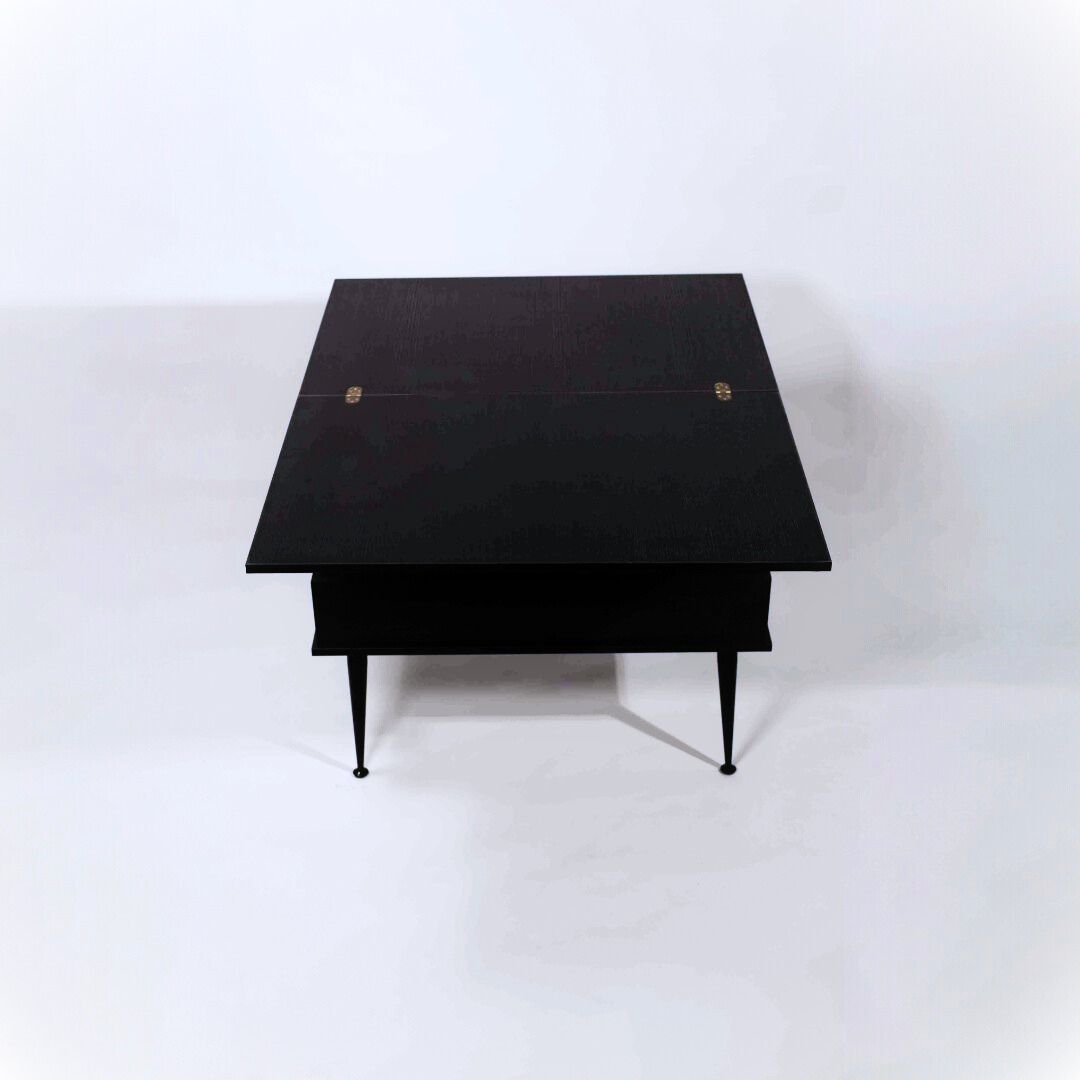 A black table with metal legs on a white background
