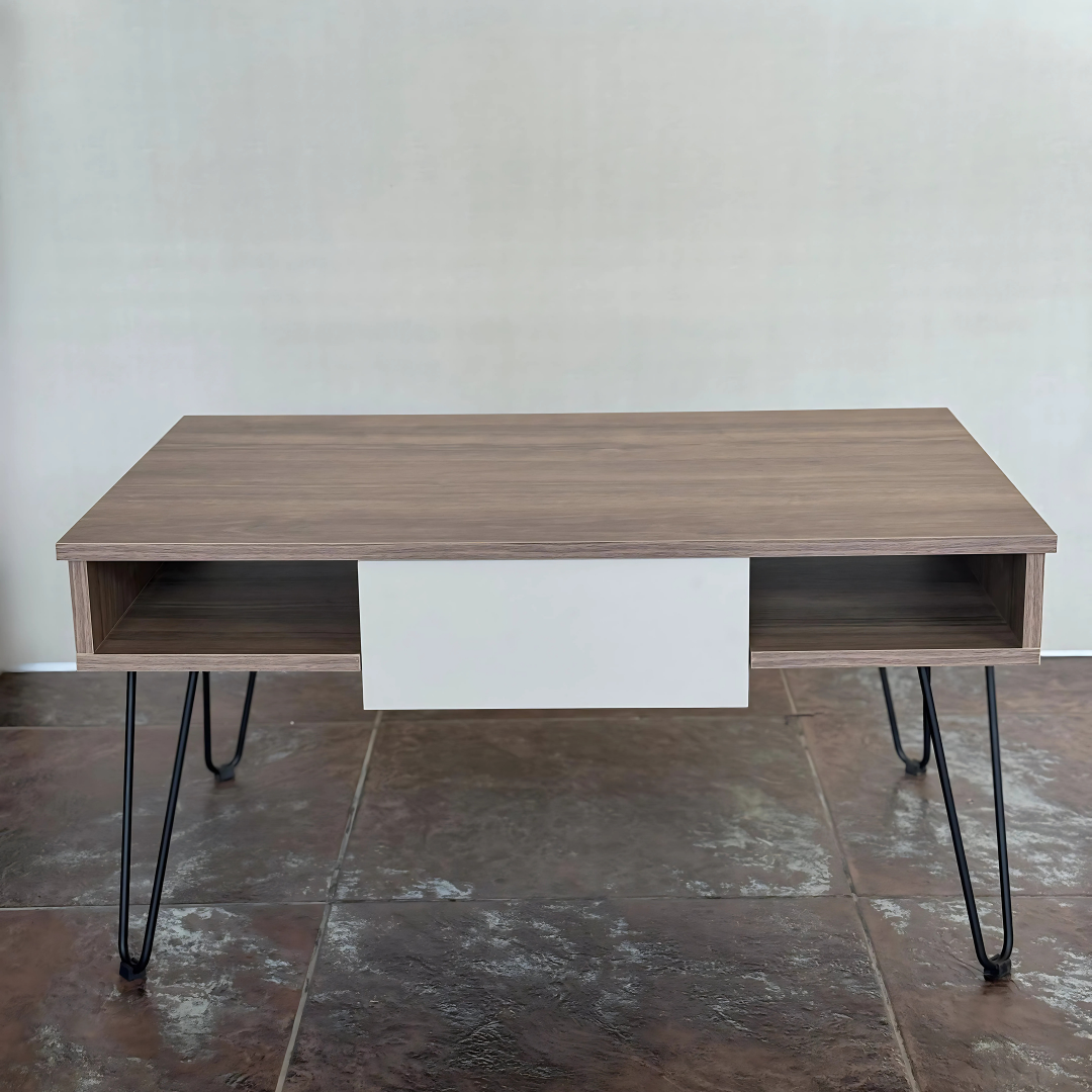 Close-up angled view of a modern center table with a walnut wood finish, showing partially opened side drawers on metal hairpin legs.