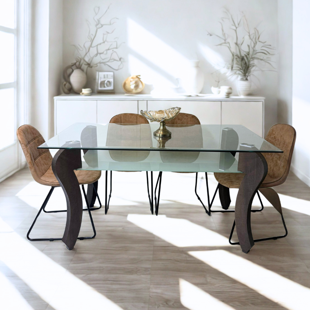 A modern dining set with a glass tabletop and sculptural black legs, bathed in natural light and surrounded by six brown cushioned chairs.