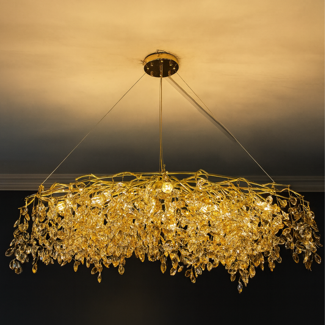 Gold chandelier with crystal accents against a dark background