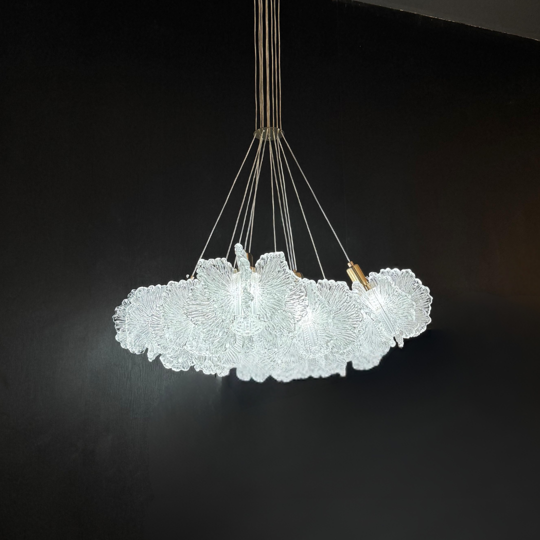 Glass chandelier with a cloud-like design on a black background