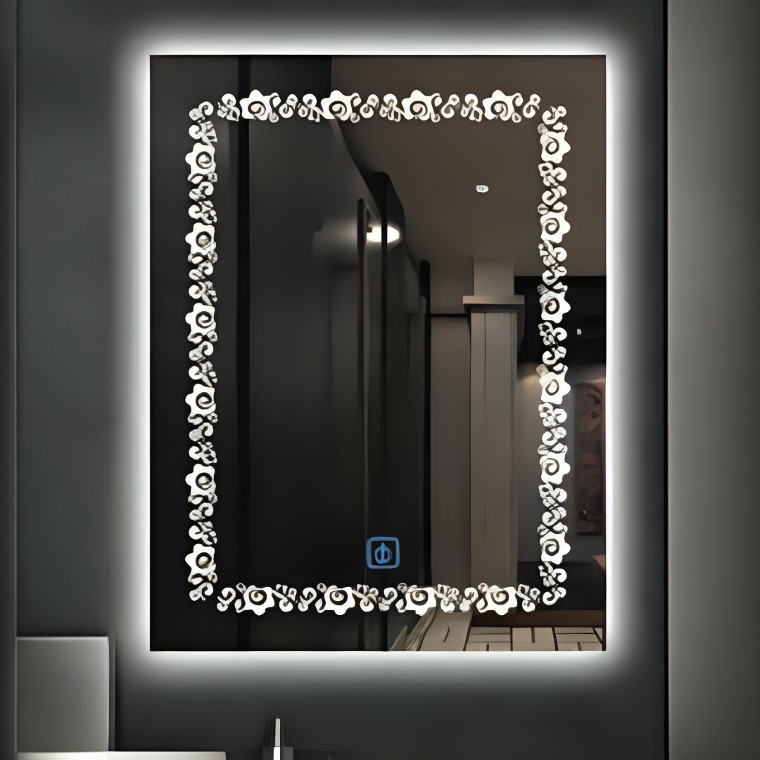 Decorative mirror with floral frame and LED lighting on a dark wall.