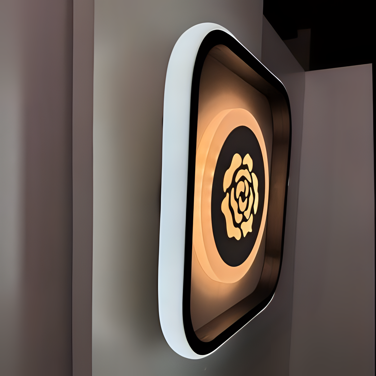 Modern square LED wall light with rose-shaped design and warm glow