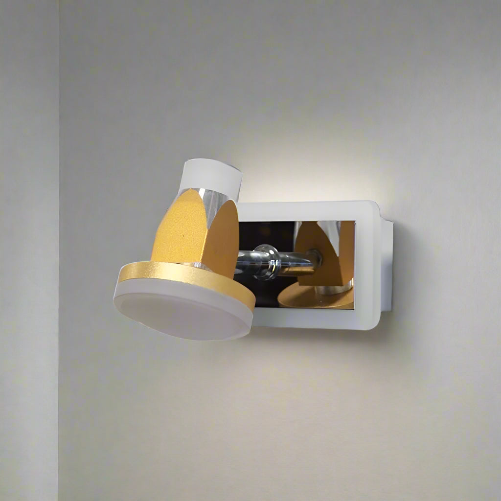 A contemporary light wall fixture with a polished metal base, featuring white and gold adjustable lampshades shaped like small spotlights.