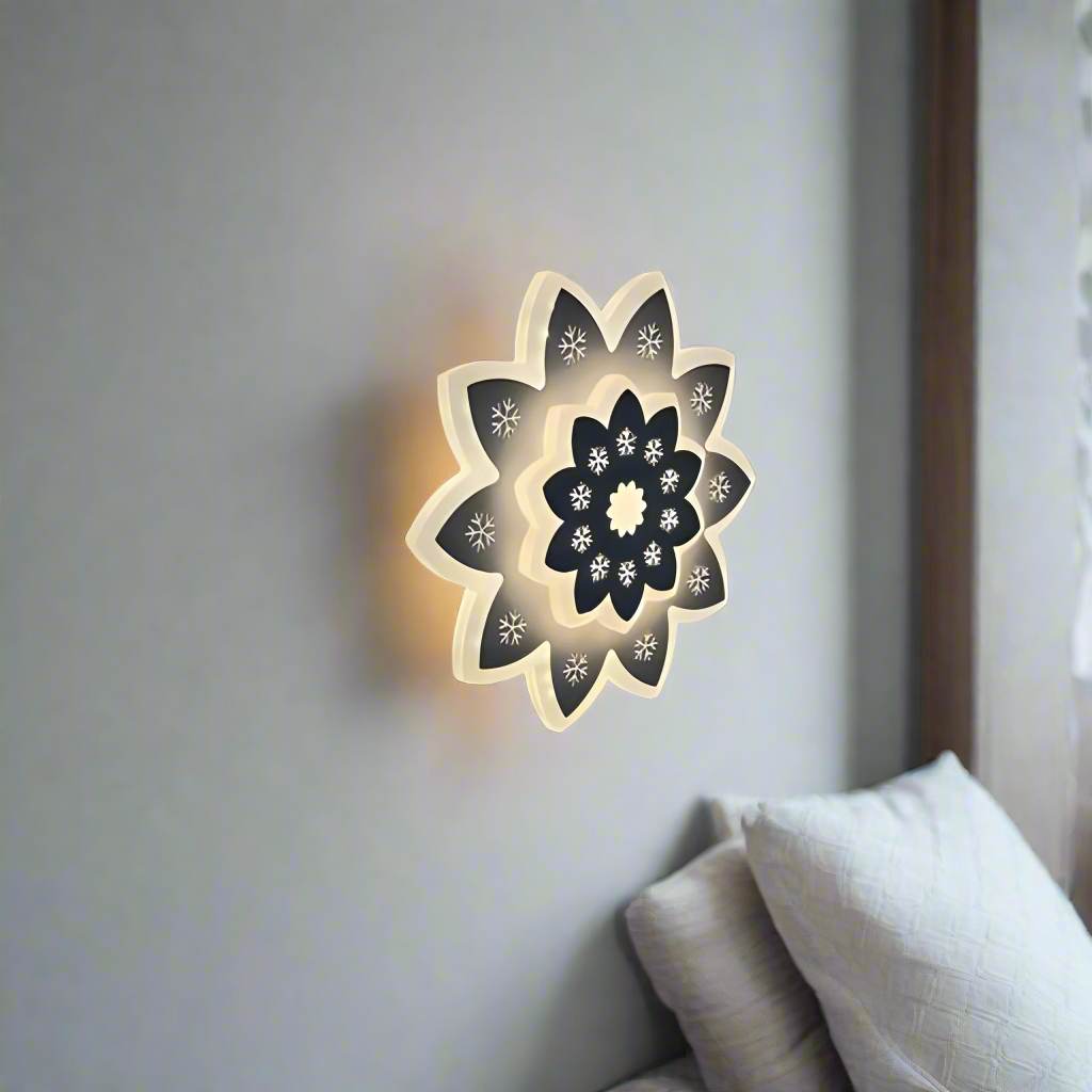 Modern Flower LED Wall Light in a sleek flower shape, crafted from metal and acrylic, fixed on a white wall, emitting soft, warm white light.