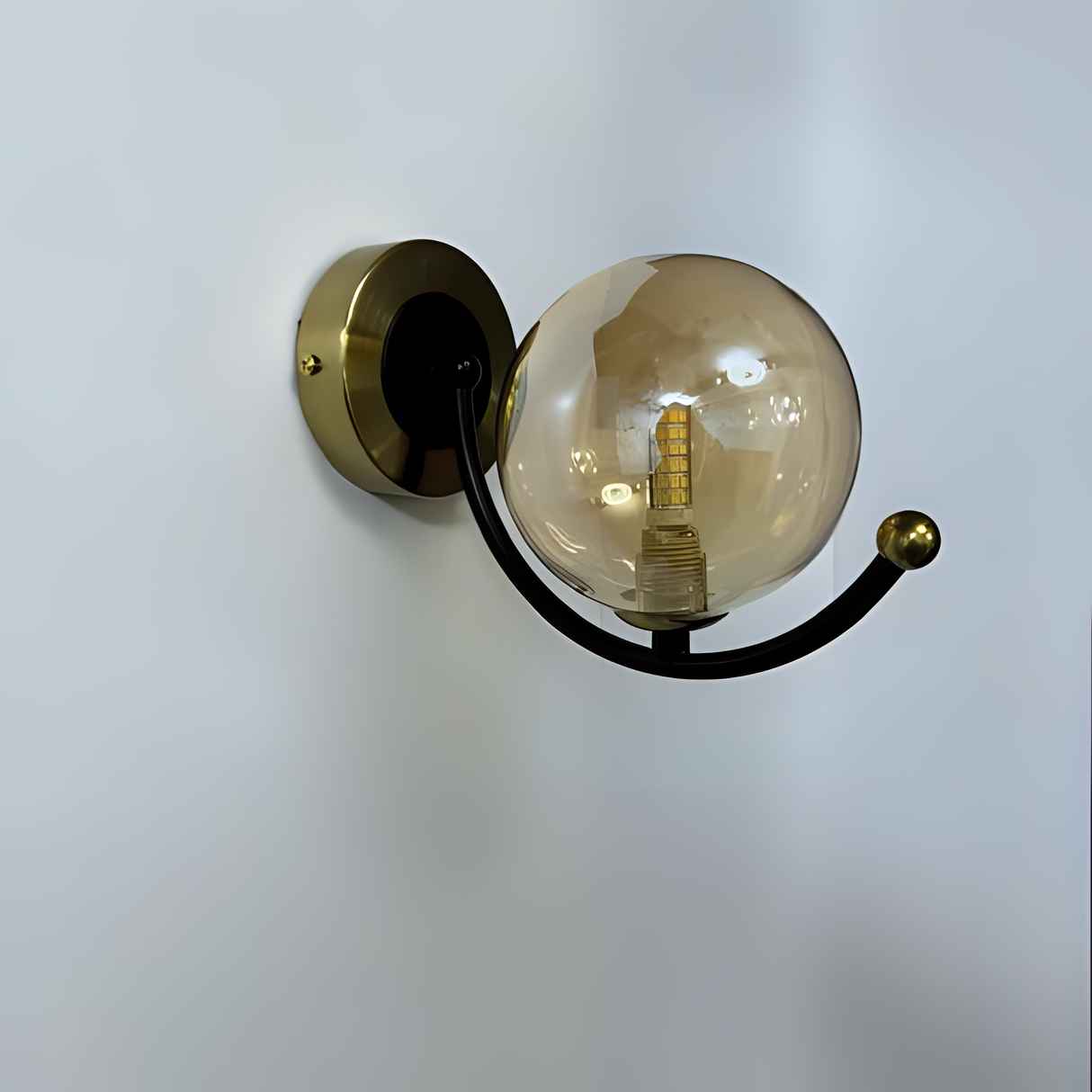 Modern globe-shaped wall light with a transparent glass sphere and black metal arm, featuring a G9 LED bulb and circular wall mount against a neutral-colored wall.