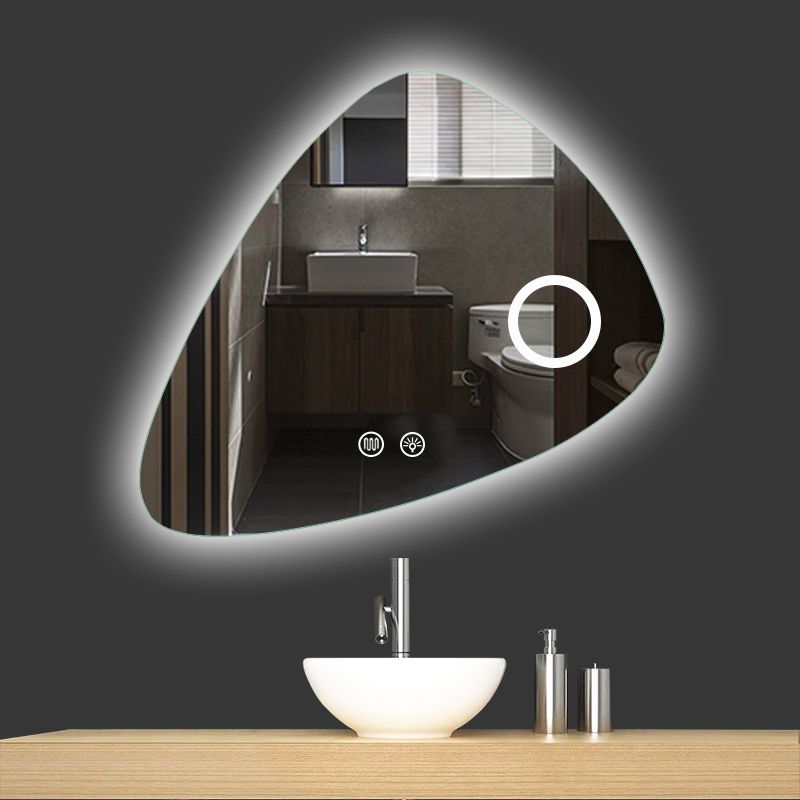 Bathroom vanity with a large illuminated mirror reflecting the bathroom interior.