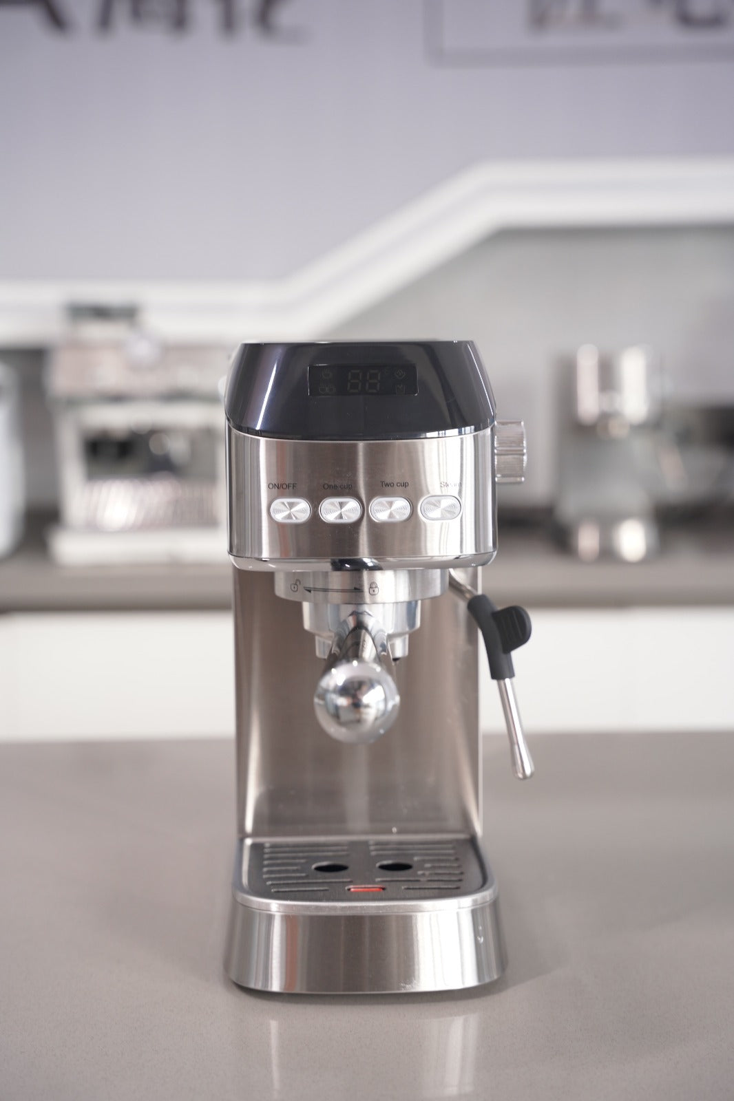 Stainless steel espresso machine on a kitchen counter