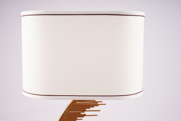Cylindrical white lampshade fabric shade with a thin brown trim at the edges.