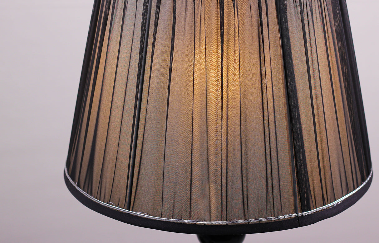 black pleated lampshade adorned with silver trim, equipped with an E27 LED light, emits a warm and sophisticated glow.