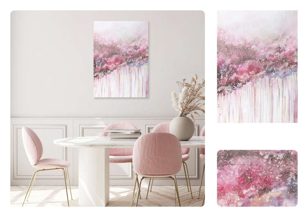 Dining room with pink chairs, white table, and abstract pink and gray wall art.