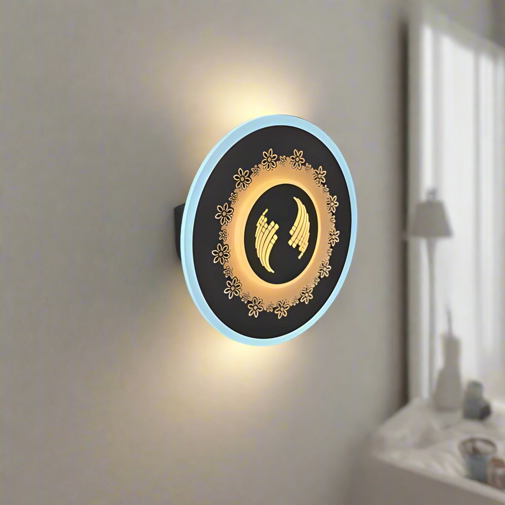 White round wall lamp featuring a small flower motif, mounted on a white wall.