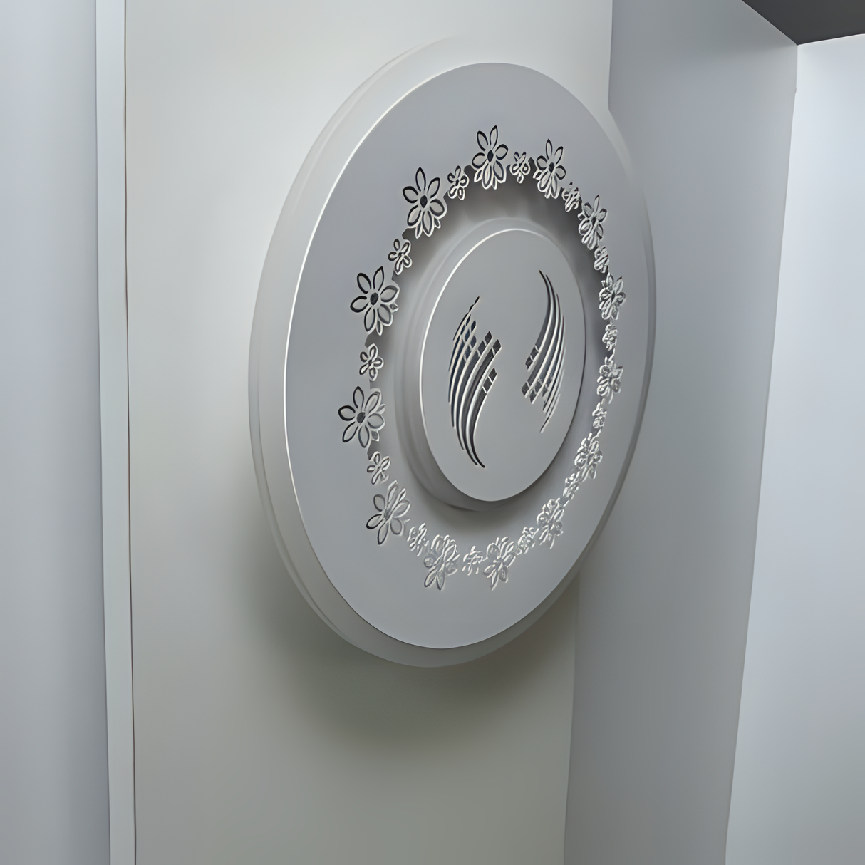 White round wall lamp featuring a small flower motif, mounted on a white wall.
