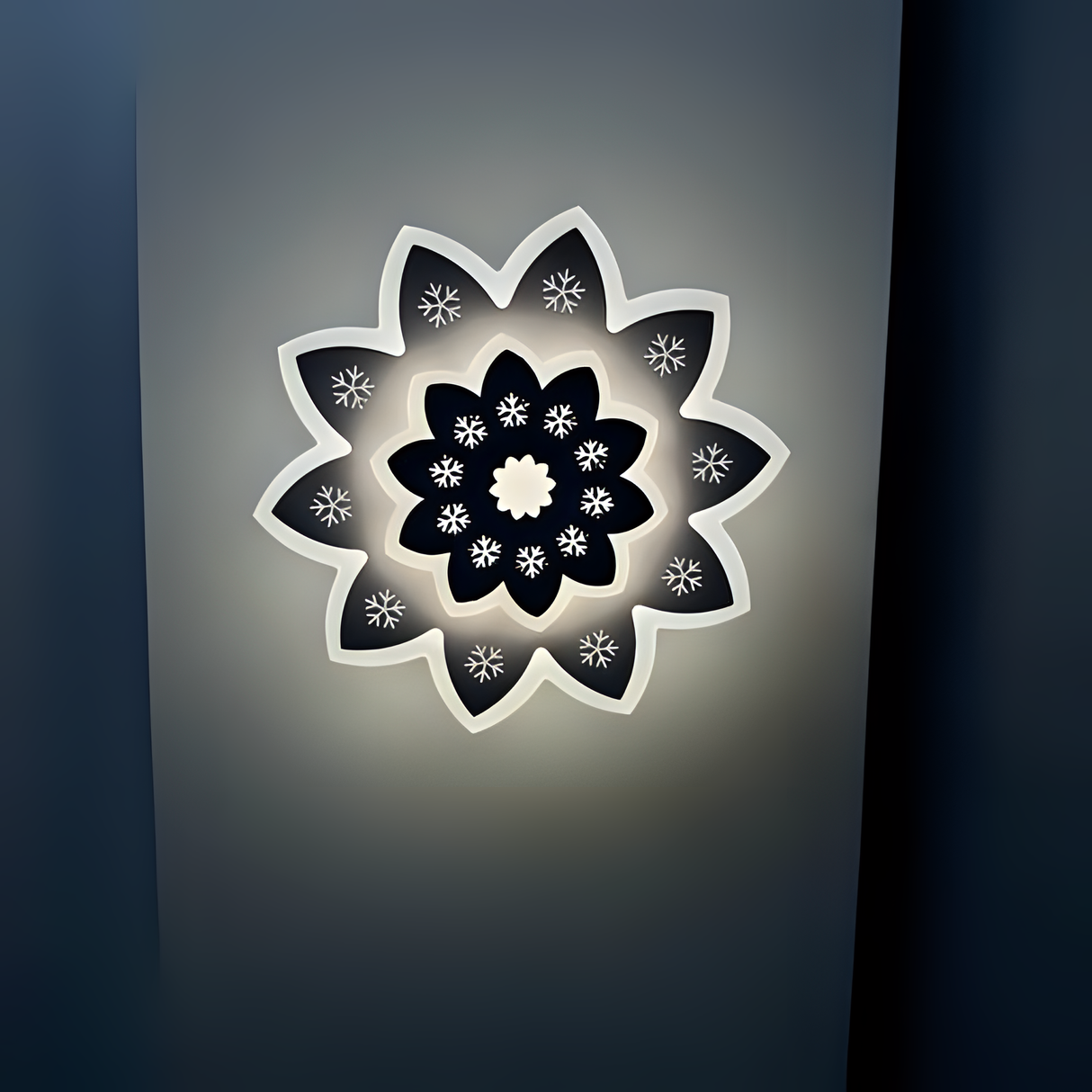 Modern Flower LED Wall Light in a sleek flower shape, crafted from metal and acrylic, fixed on a white wall, emitting soft, warm white light.
