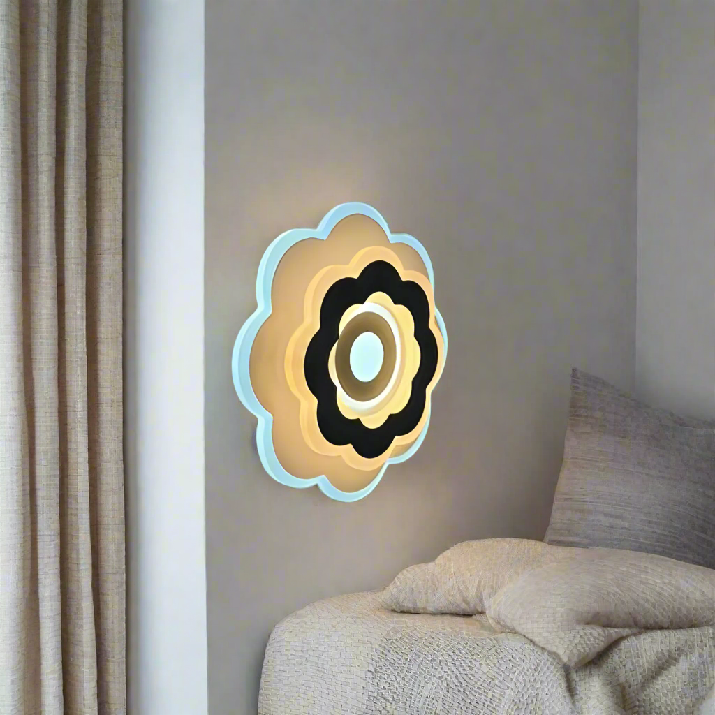 Modern Flower LED Wall Light in a sleek flower shape, crafted from metal and acrylic, fixed on a white wall, emitting soft, warm white light.