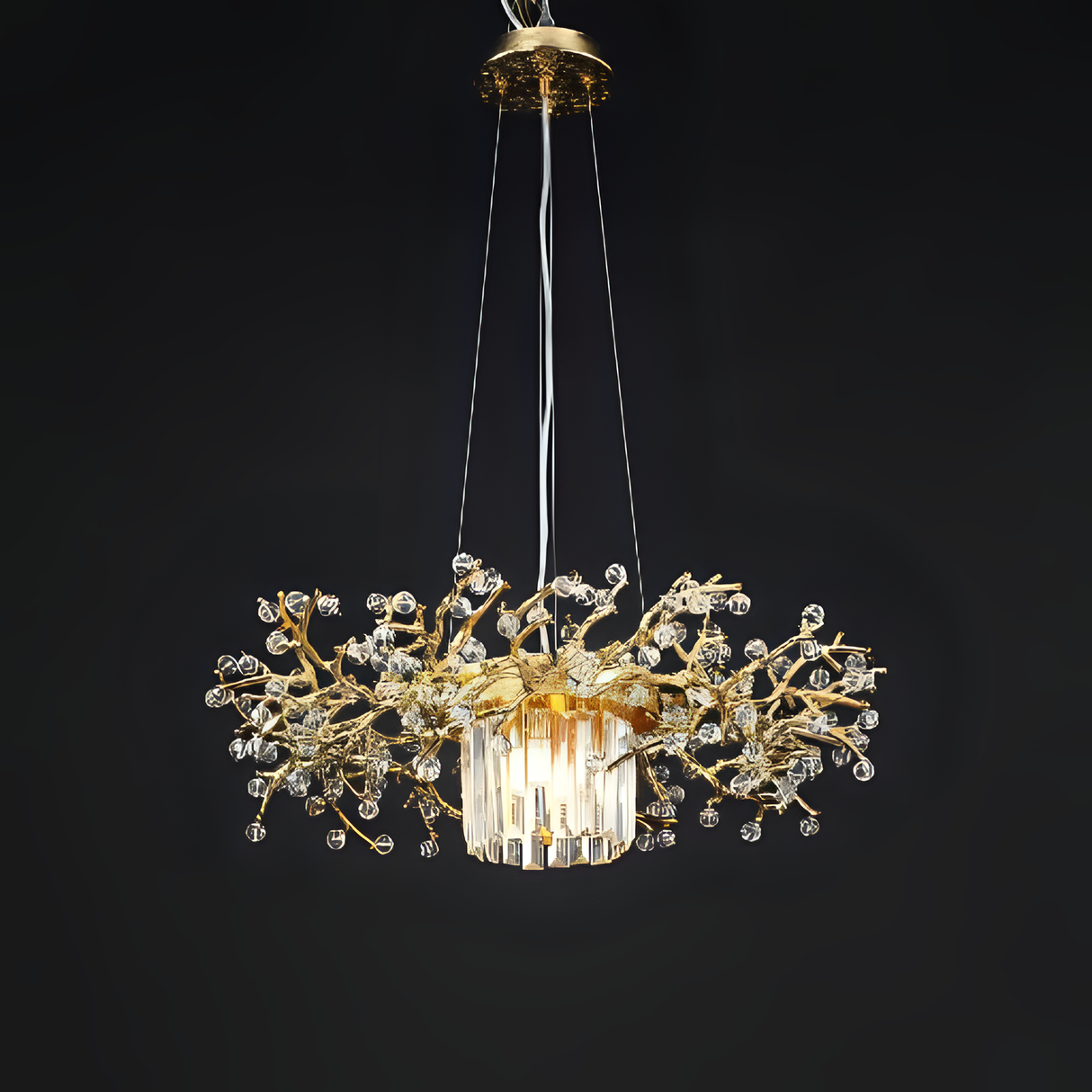 A luxurious gold and crystal chandelier with a sculptural design resembling intertwined branches.