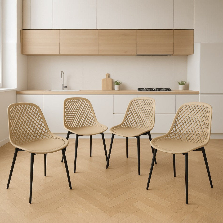 Four beige chairs with black legs arranged in a kitchen setting.