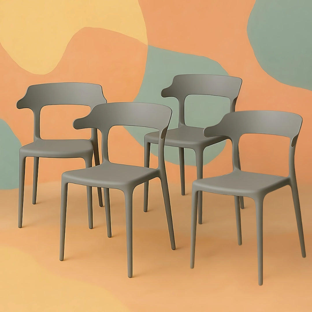 Four gray chairs on a colorful abstract background