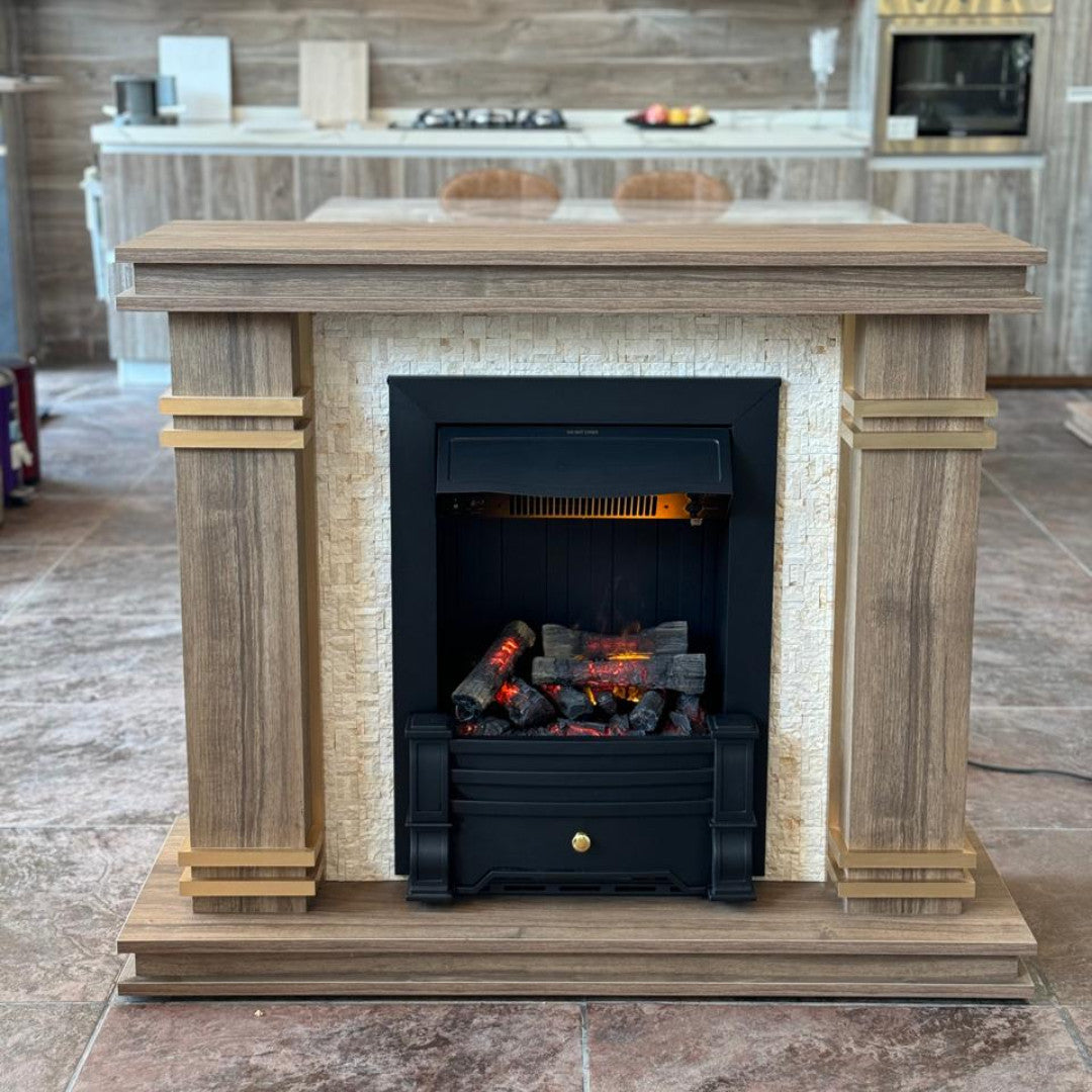 A traditional-style wooden fireplace with a cream-colored insert, golden trim, and a black electric firebox with glowing embers.
