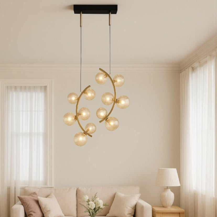 Modern living room with a gold chandelier, beige sofa, and wooden coffee table.