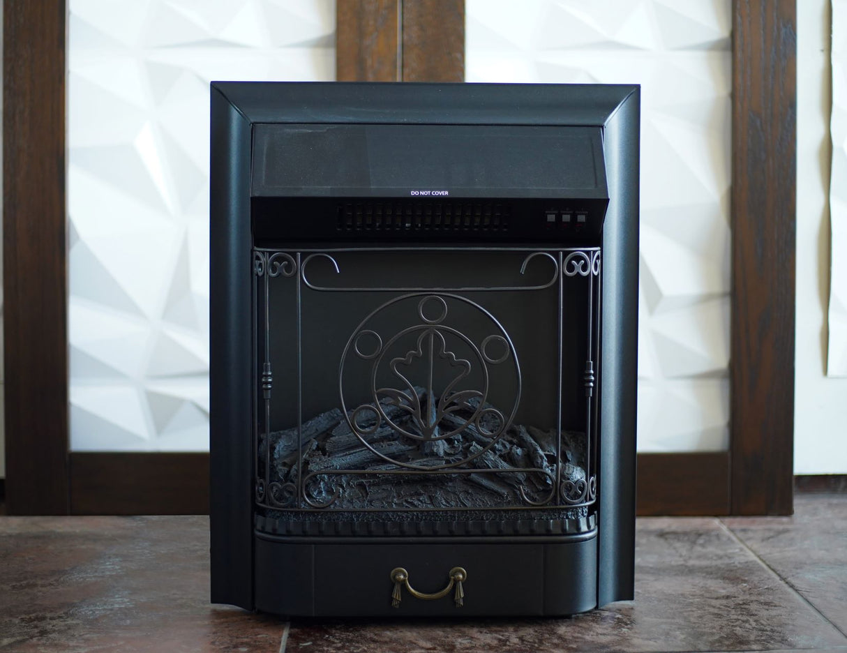 A black freestanding electric fireplace with an ornate front design, featuring unlit artificial logs inside.