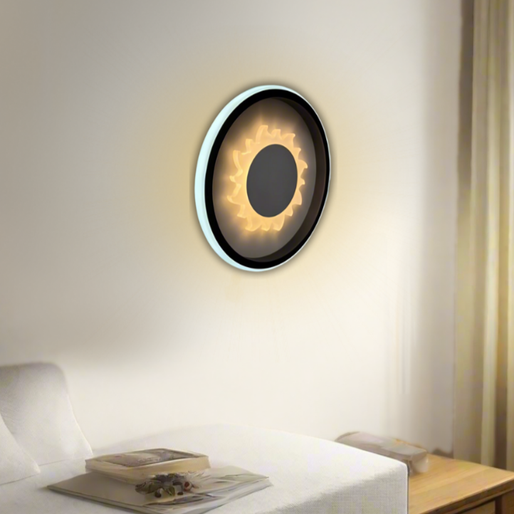 Modern circular LED wall light with heart-shaped design, fixed on a white wall.