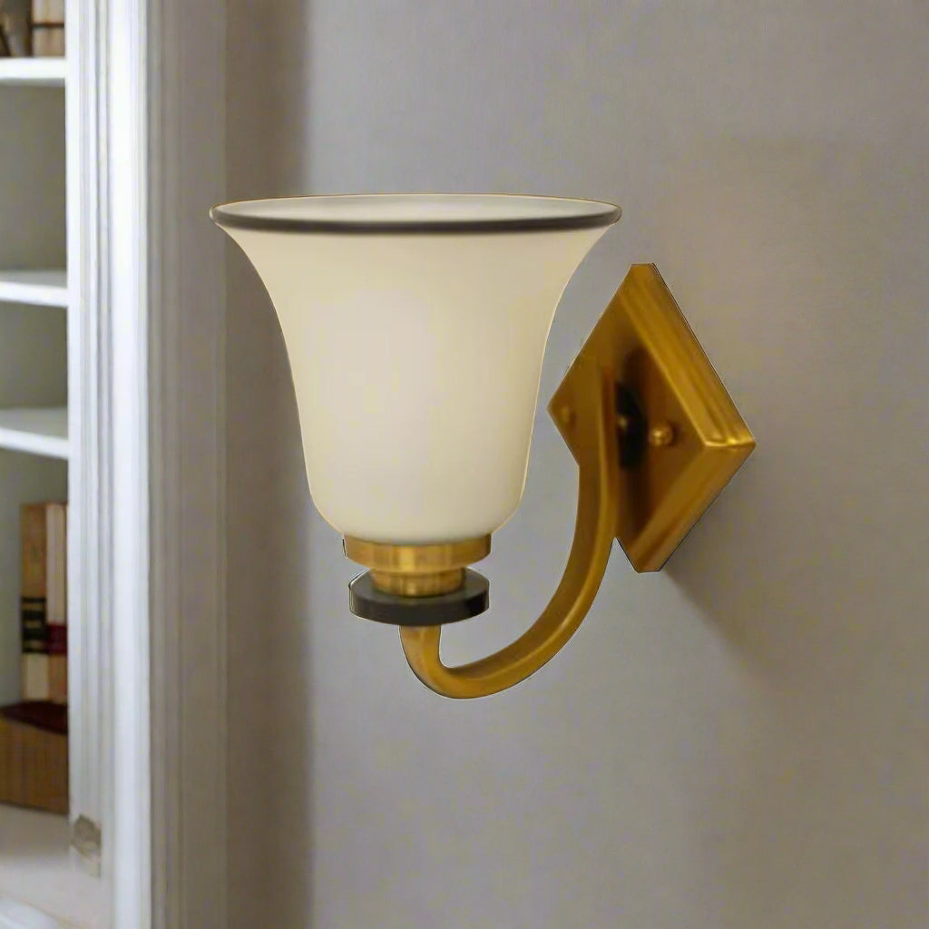wall light mounted on a light grey wall next to white bookcase