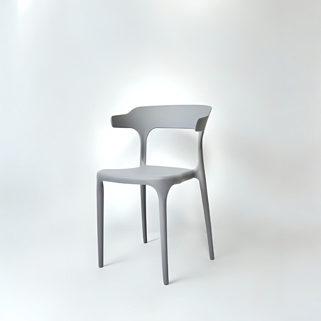 A light grey plastic chair with a hard backrest and seat without any visible brand markings.