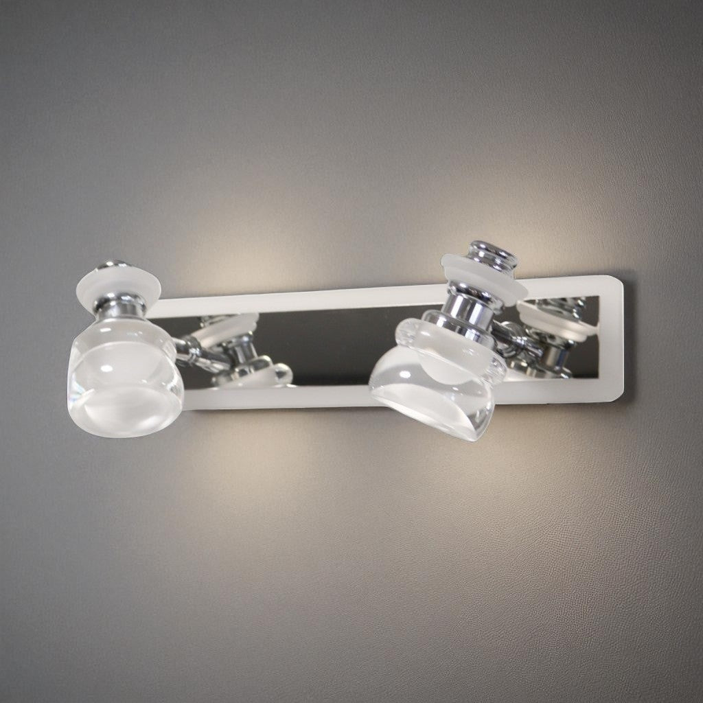 A sleek and contemporary double-led bulb chrome wall light fixture with clear glass shades, mounted on a metallic base.