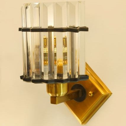 gold and crystal wall sconce with LED bulb E27 visible through the clear glass rods.