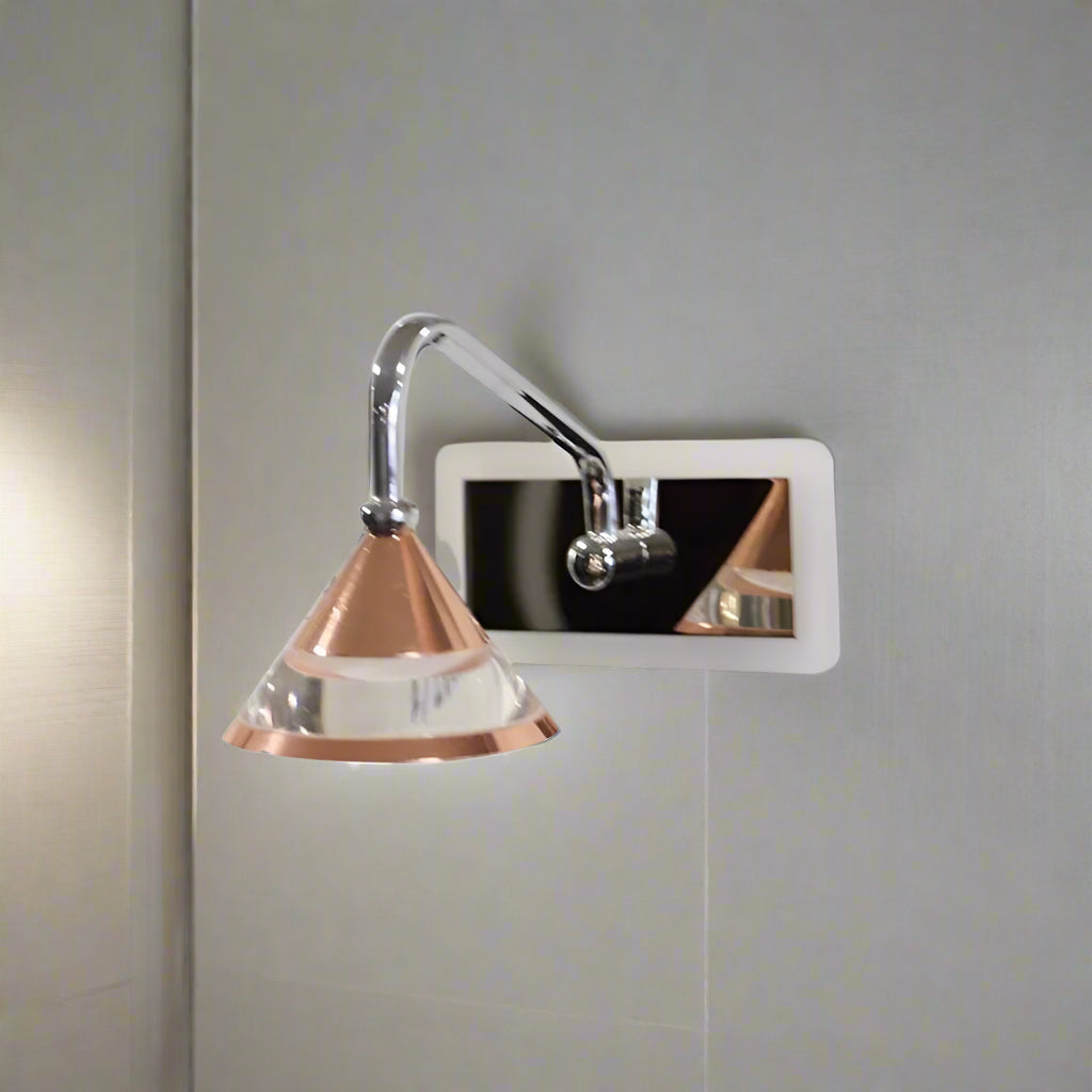 A modern light wall fixture with adjustable chrome and glass lampshades.