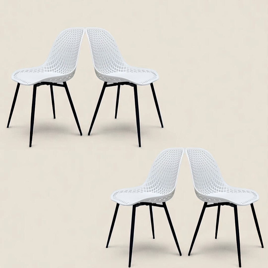 Two white mesh-style chairs with black metal legs, angled slightly toward each other on a light background.