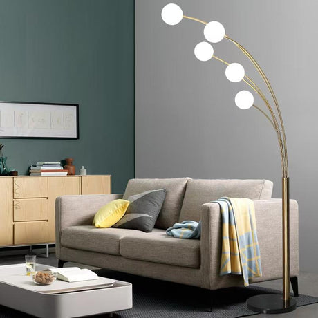Modern living room with a gray sofa, floor lamp, and sideboard.