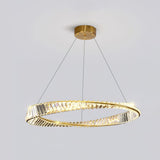 A modern gold and crystal circular chandelier