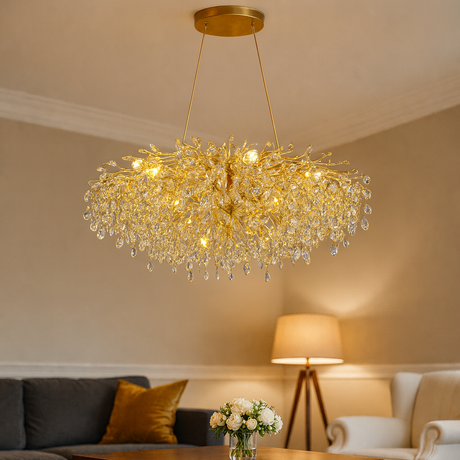 Gold chandelier hanging in a living room with a neutral color scheme.