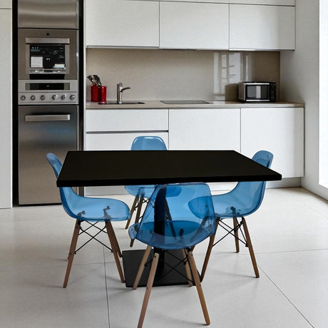 Modern kitchen with a black dining table and blue chairs.