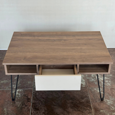 Top-down view of the table emphasizing the symmetrical design and hidden storage compart
