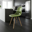 Green chair with wooden legs in a modern kitchen setting