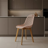 Chair with woven seat and wooden legs on a white background