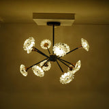Round black and gold modern chandelier, showcasing a central matte black fixture base.