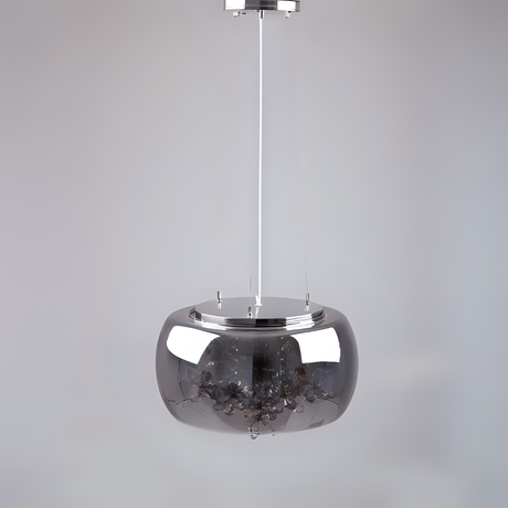 A sleek and minimalist metallic pendant light with a reflective chrome dome-shaped shade, suspended by a thin white cord against a plain light grey background.