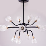 A black chandelier with multiple arms and clear, textured glass globes