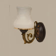 A classic bronze wall sconce with a decorative backplate and a fluted frosted glass shade, exuding a vintage charm.