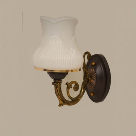 A classic bronze wall sconce with a decorative backplate and a fluted frosted glass shade, exuding a vintage charm.