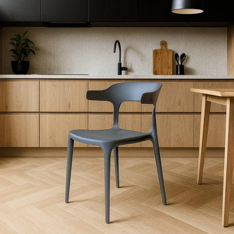 Gray chair in a modern kitchen with wooden cabinets and a countertop.