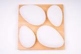 A small image showing a modern flush-mount ceiling light with four rounded triangular LED panels arranged in a symmetrical clover shape. The fixture is mounted flush against a light-colored ceiling, suitable for bedrooms, living rooms, or cozy indoor spaces.

