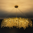 Gold chandelier with crystal accents against a dark background