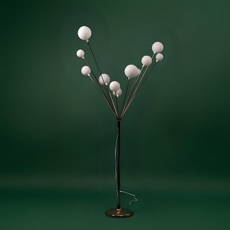 A modern artistic floor lamp with multiple spherical white bulbs branching out from a central metallic stand, set against a green background.